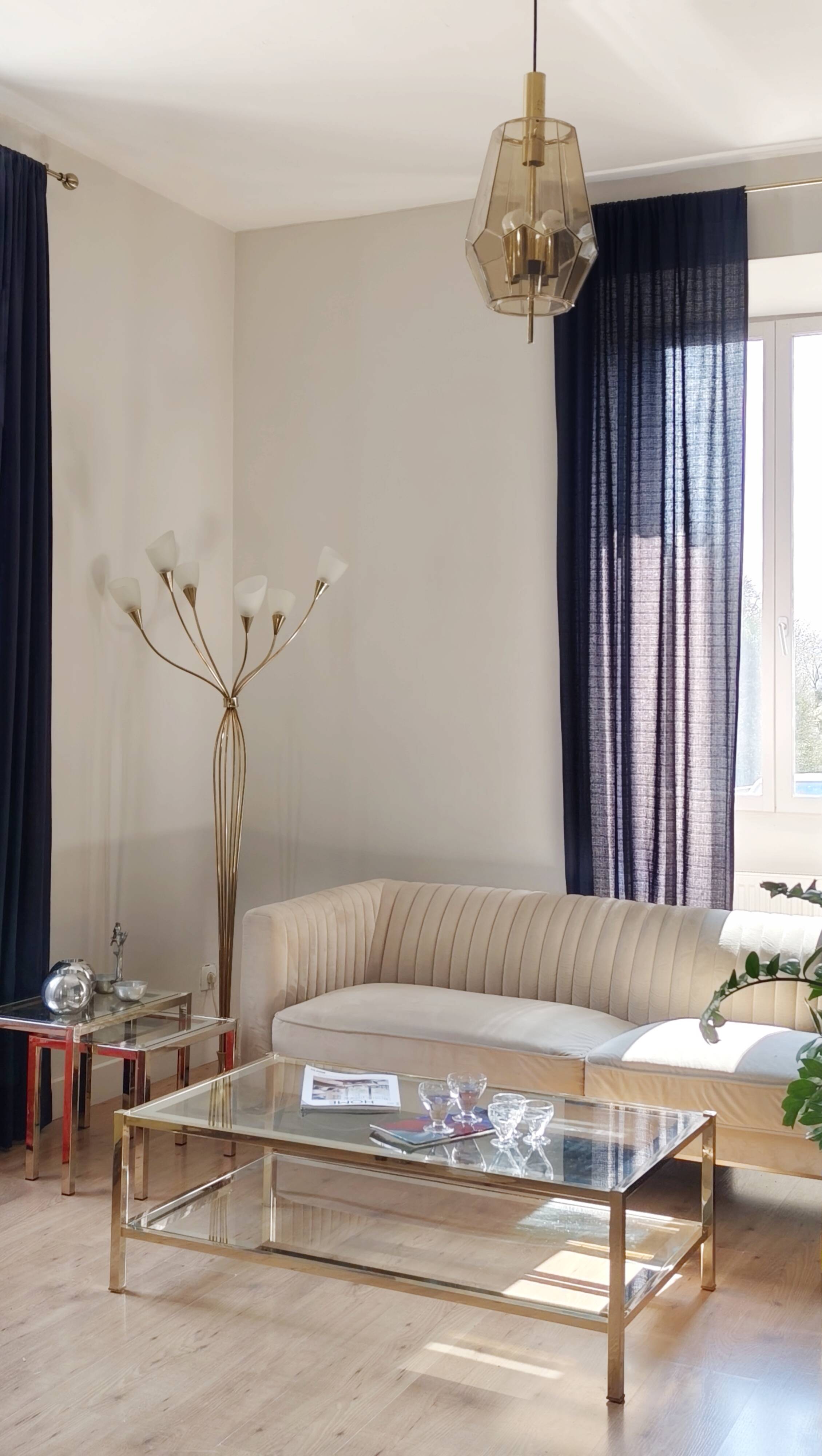 Vintage coffee table with glass, mirror, and brass.