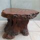 Brutalist chessboard coffee table made from tree stump.