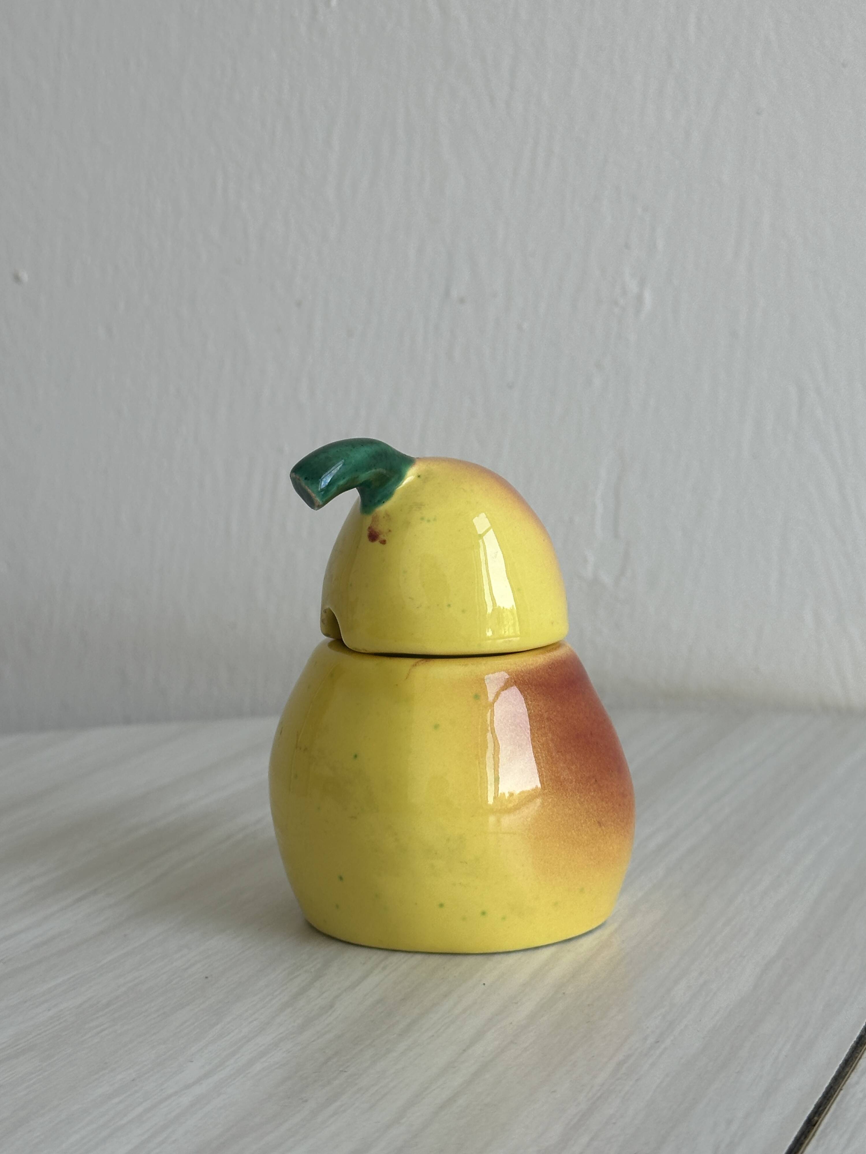 Yellow ceramic pear-shaped salt shaker
