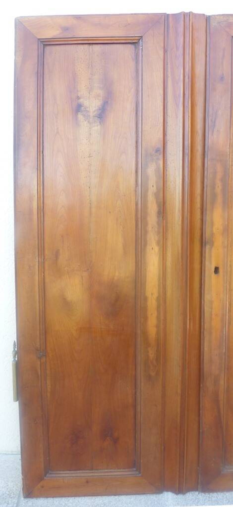 Pair of antique cherry wood cabinet doors from the 19th century in their original part