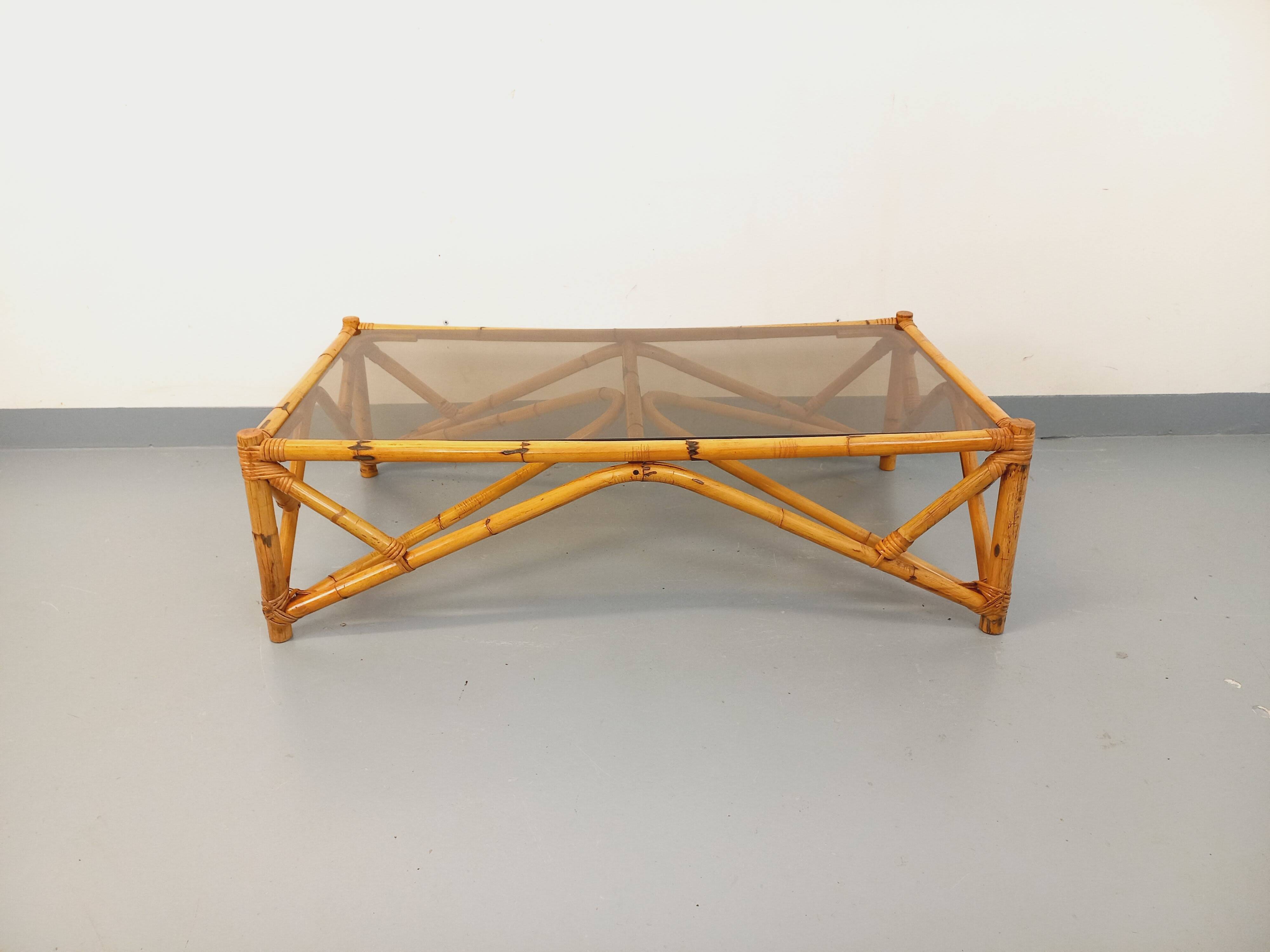 Vintage rectangular coffee table in rattan and smoked glass from the 1970s.