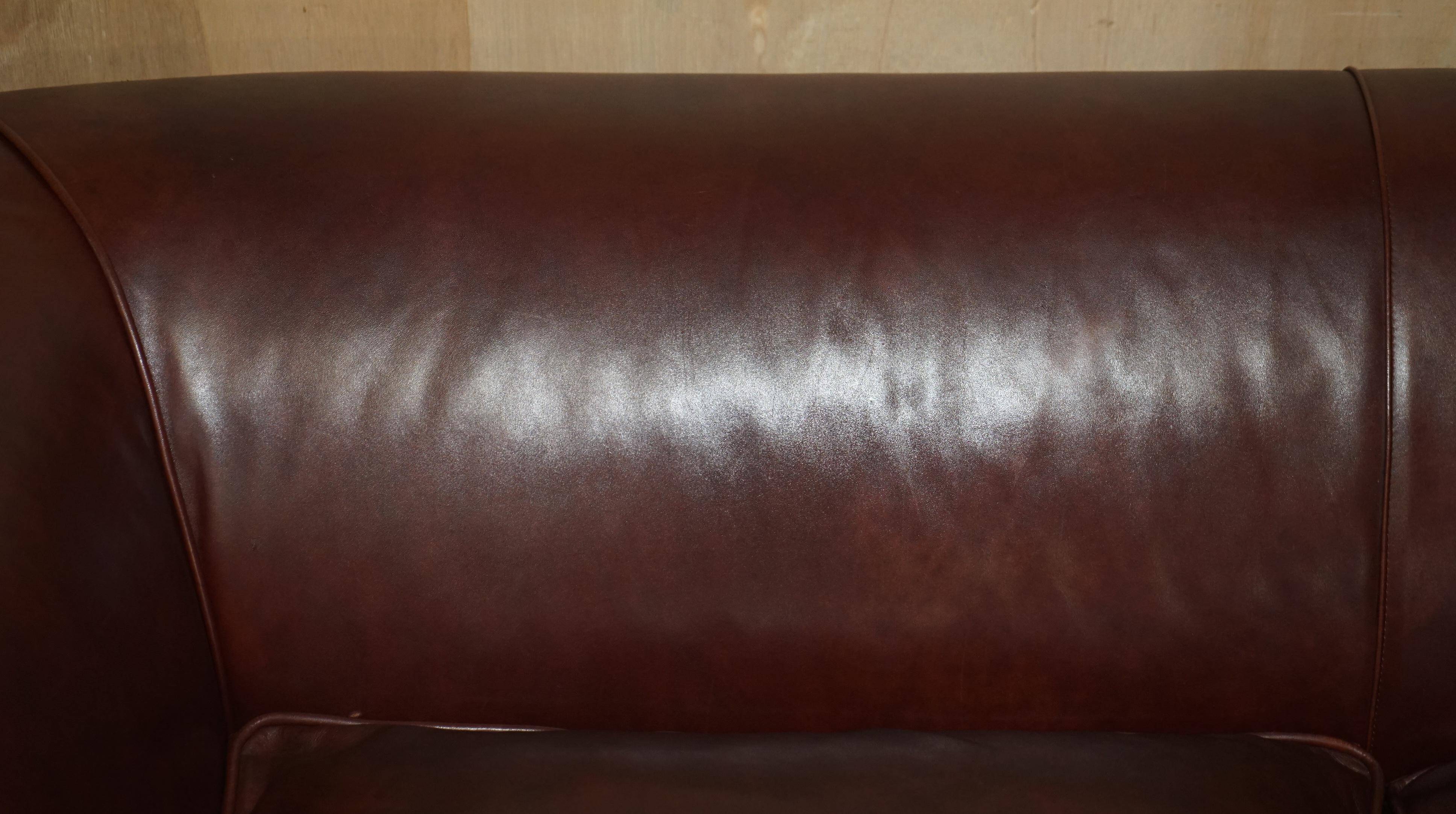 Vintage Art Deco leather sofa, three-seater, feather cushions.