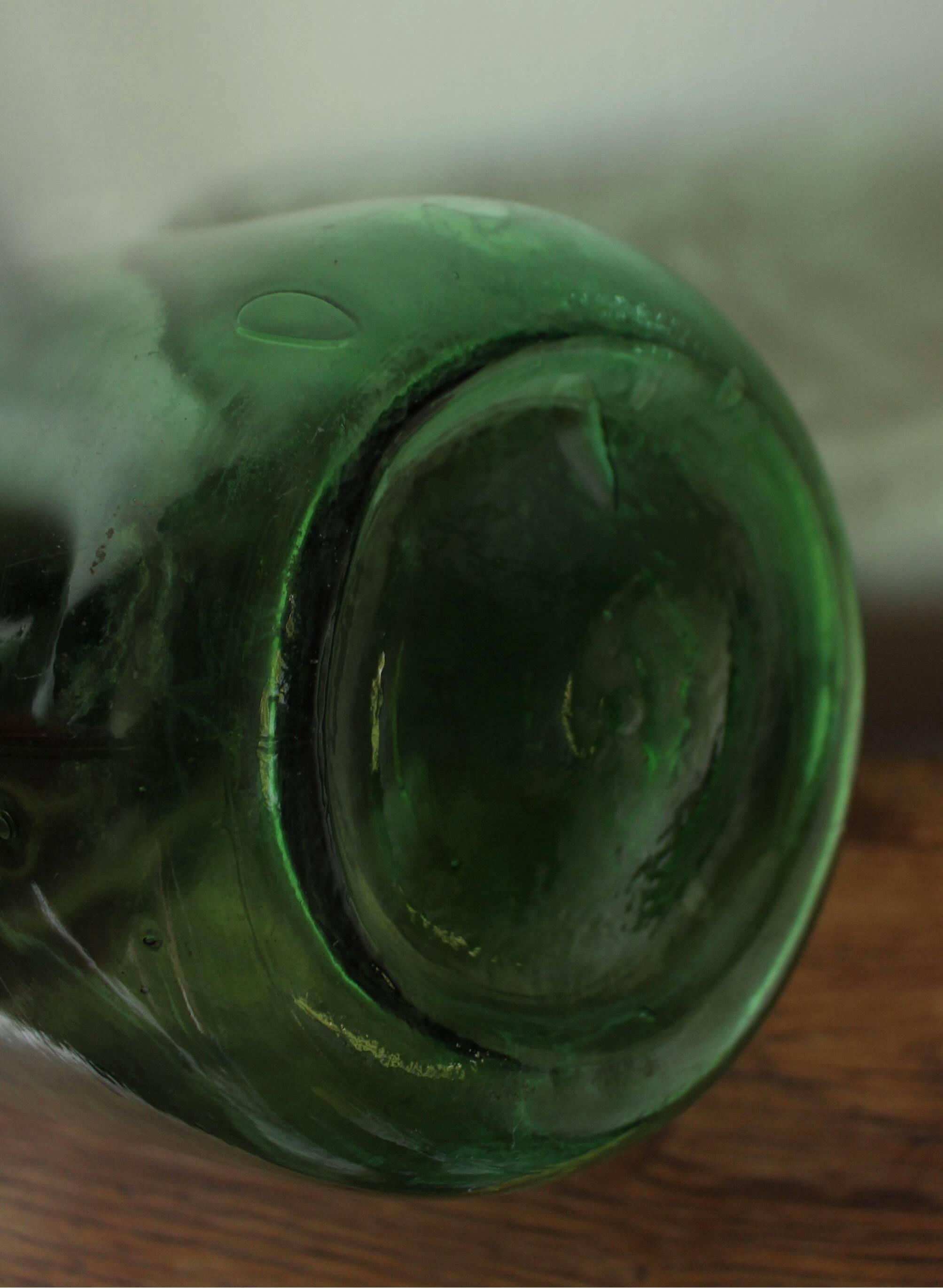 Give me a dark green glass Bonbonne jar.