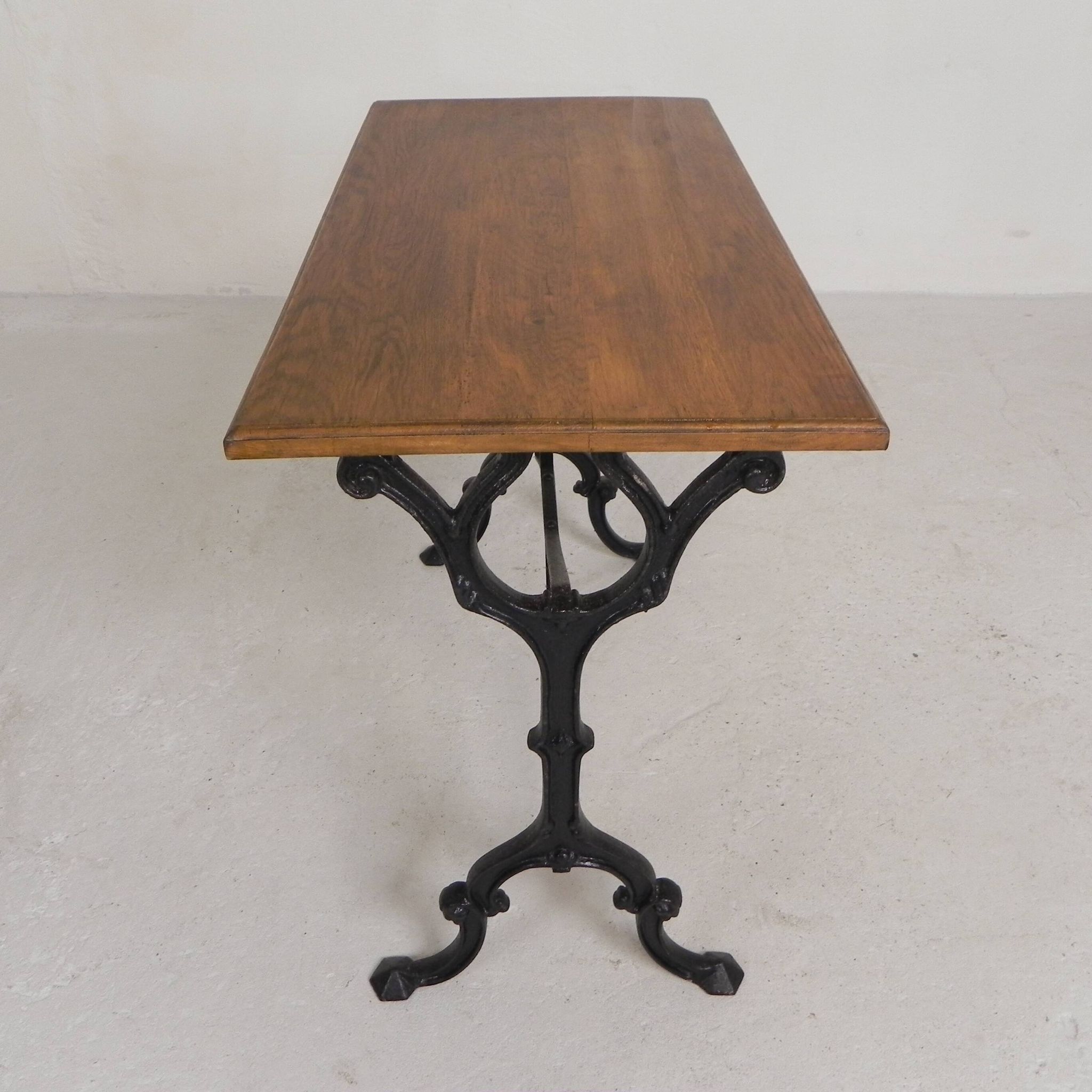 Bistro table with an oak top on a cast iron base, 1930s.