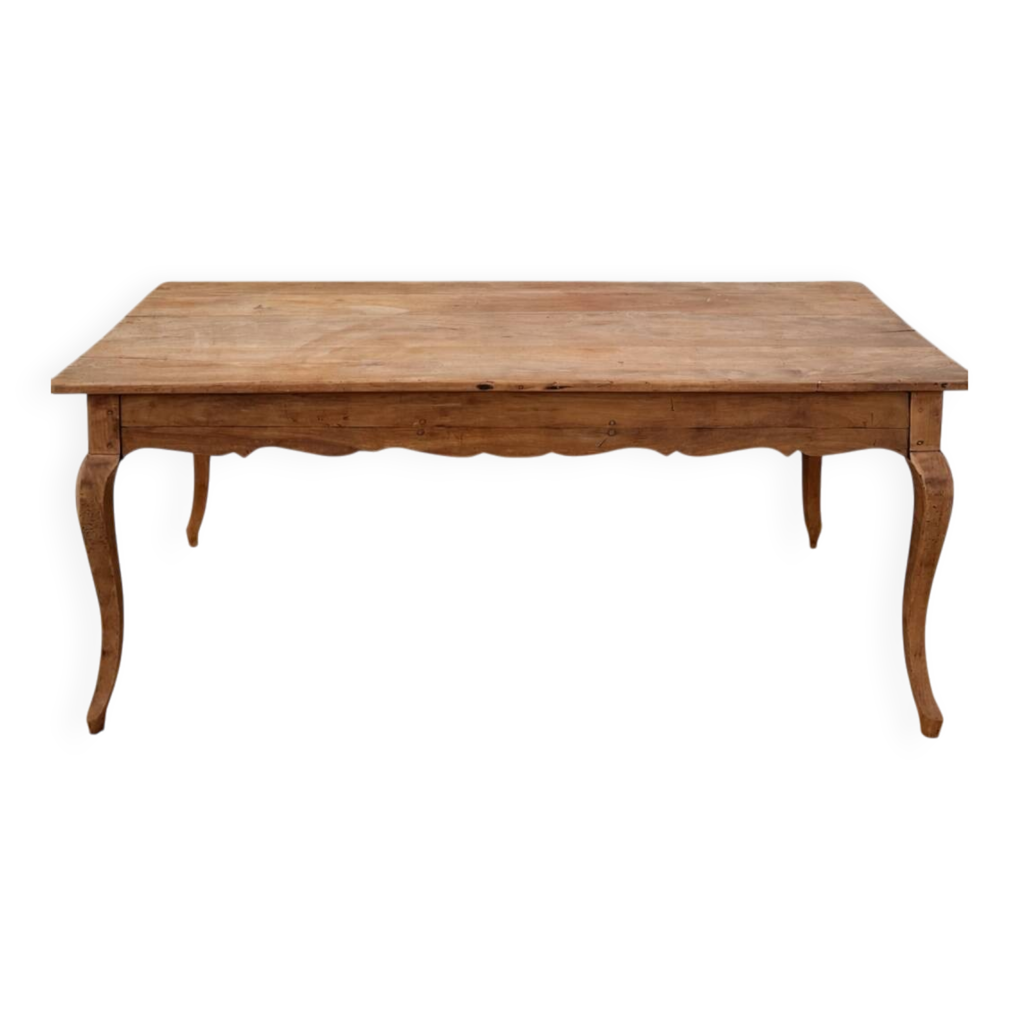 Curved farmhouse table in rustic wood, Provençal style.