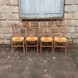 four vintage bistro-style straw chairs