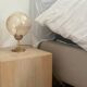 2 bedside lamps with round amber glass globes and gold metal.