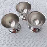 A set of 3 egg cups by Guy Degrenne.