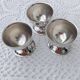 A set of 3 egg cups by Guy Degrenne.