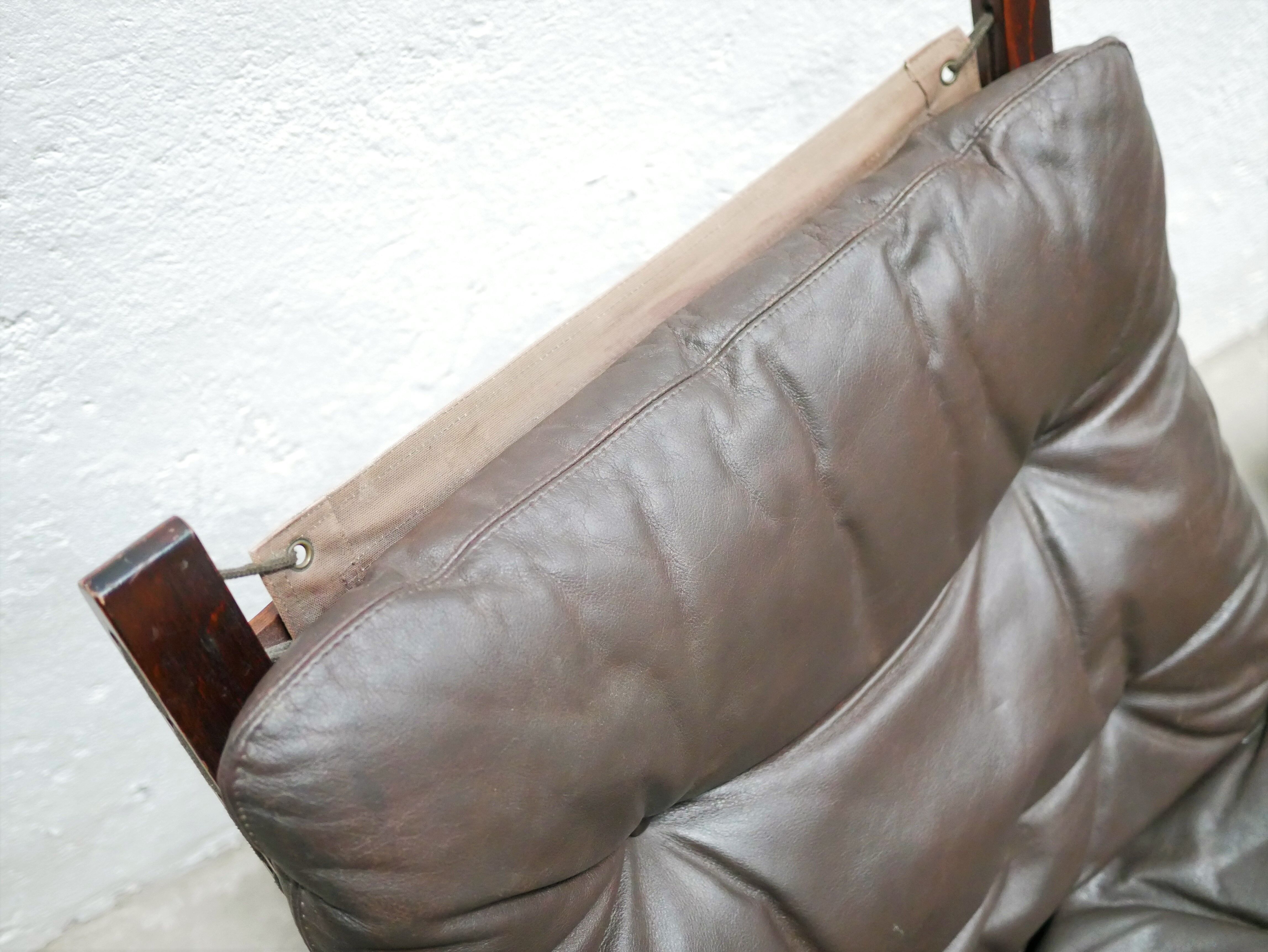 Scandinavian armchair and ottoman Siesta in brown leather by Ingmar Relling for Westnofa editions