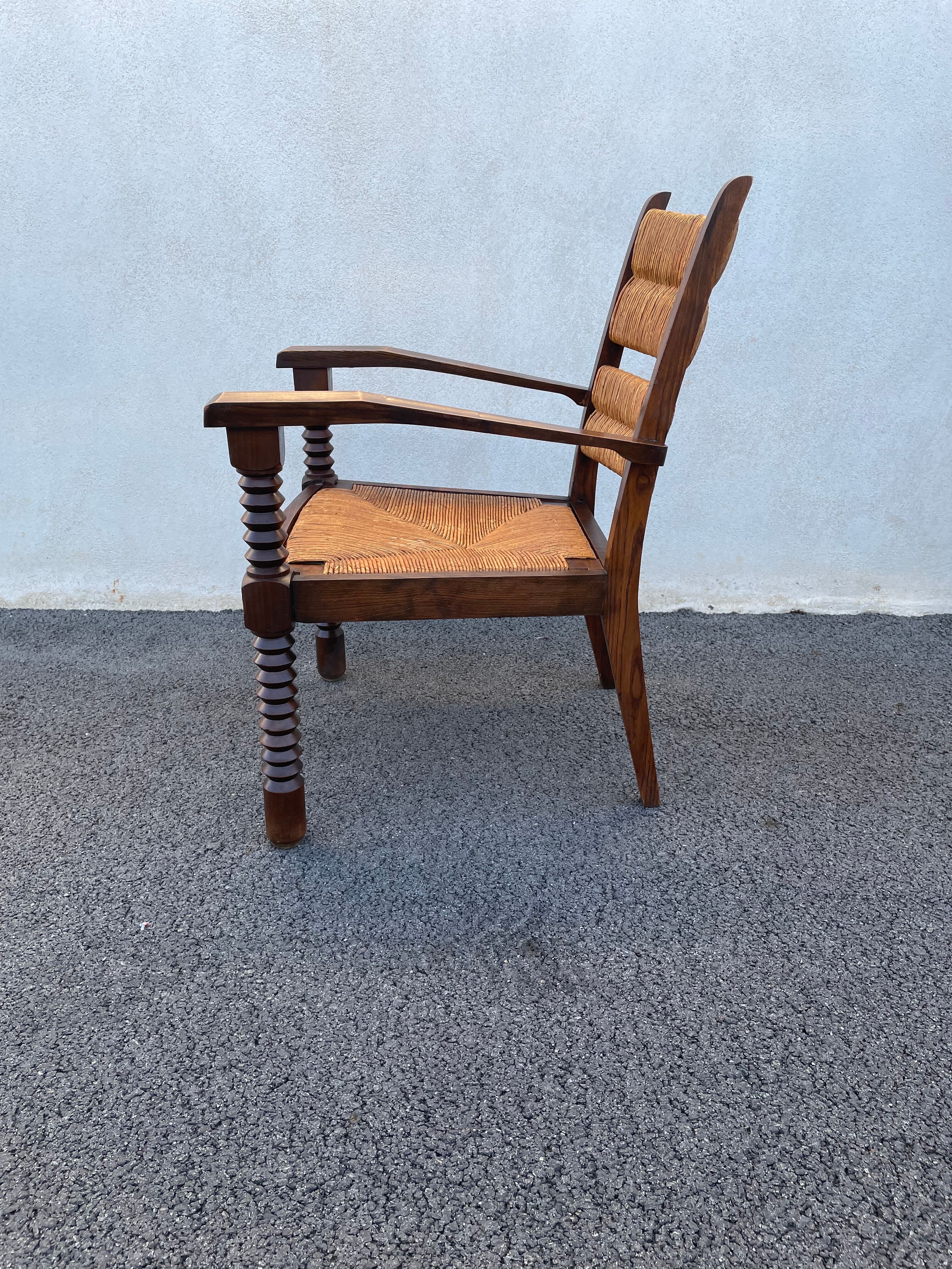 Vintage armchair in straw and brutalist wood