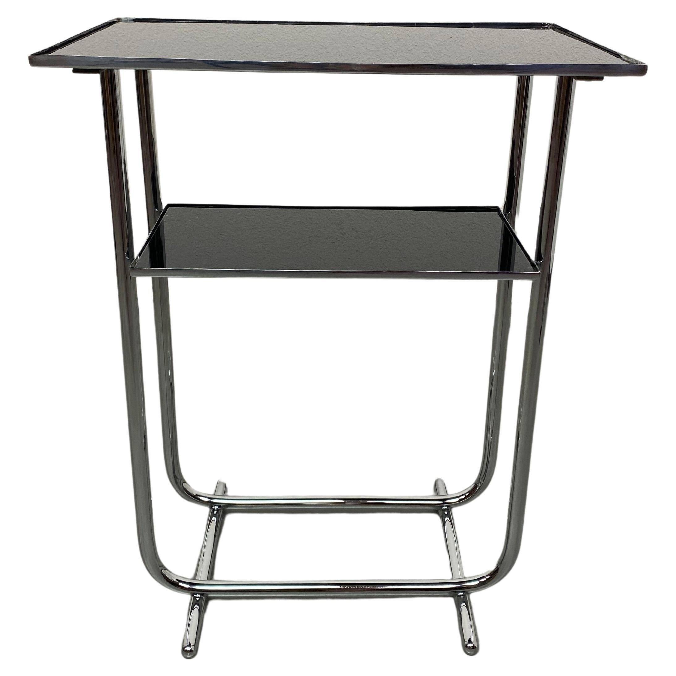 Bauhaus side table with a black glass top