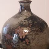 Ceramic liquor service with a decanter and 12 small glasses on tray