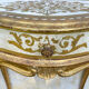 Pairs of Florentine bedside tables in gilded wood.