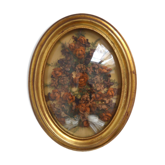 Rounded witch's eye frame including dried flowers
