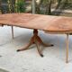 Extendable round dining table with central leg renovated in raw wood 205cm