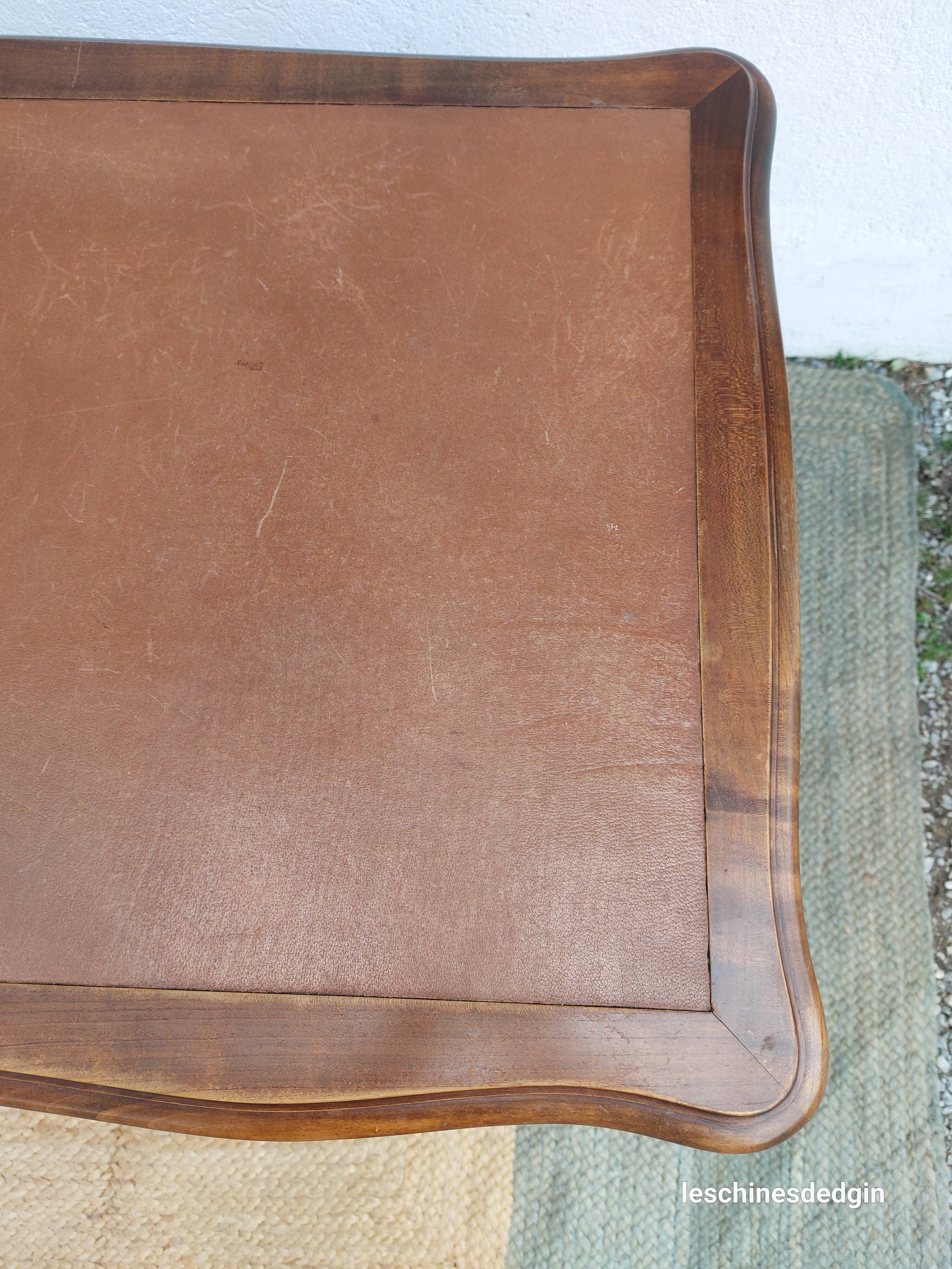 Louis XV style desk in wood, with a brown leather top.