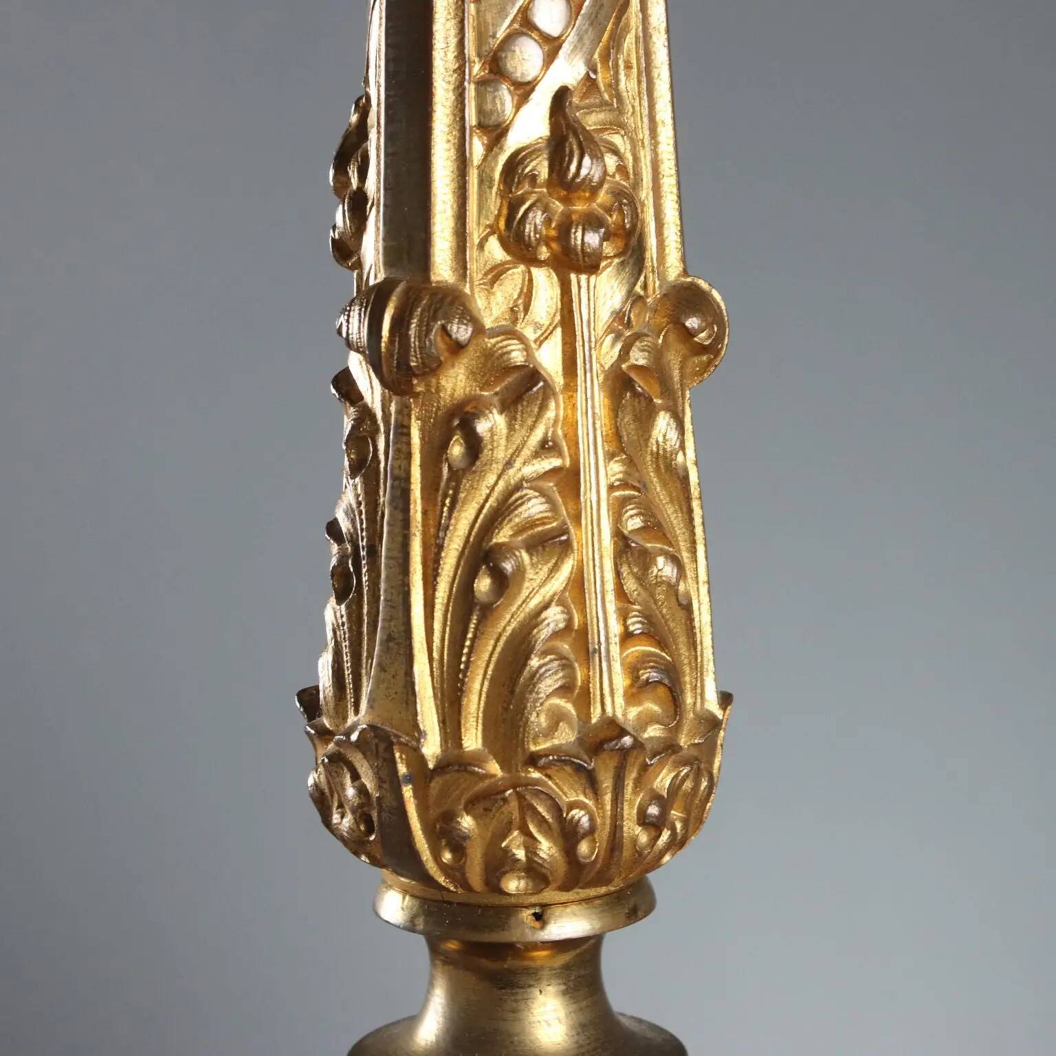Antique gilded bronze candelabrum, 19th-century decorations.