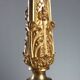 Antique gilded bronze candelabrum, 19th-century decorations.