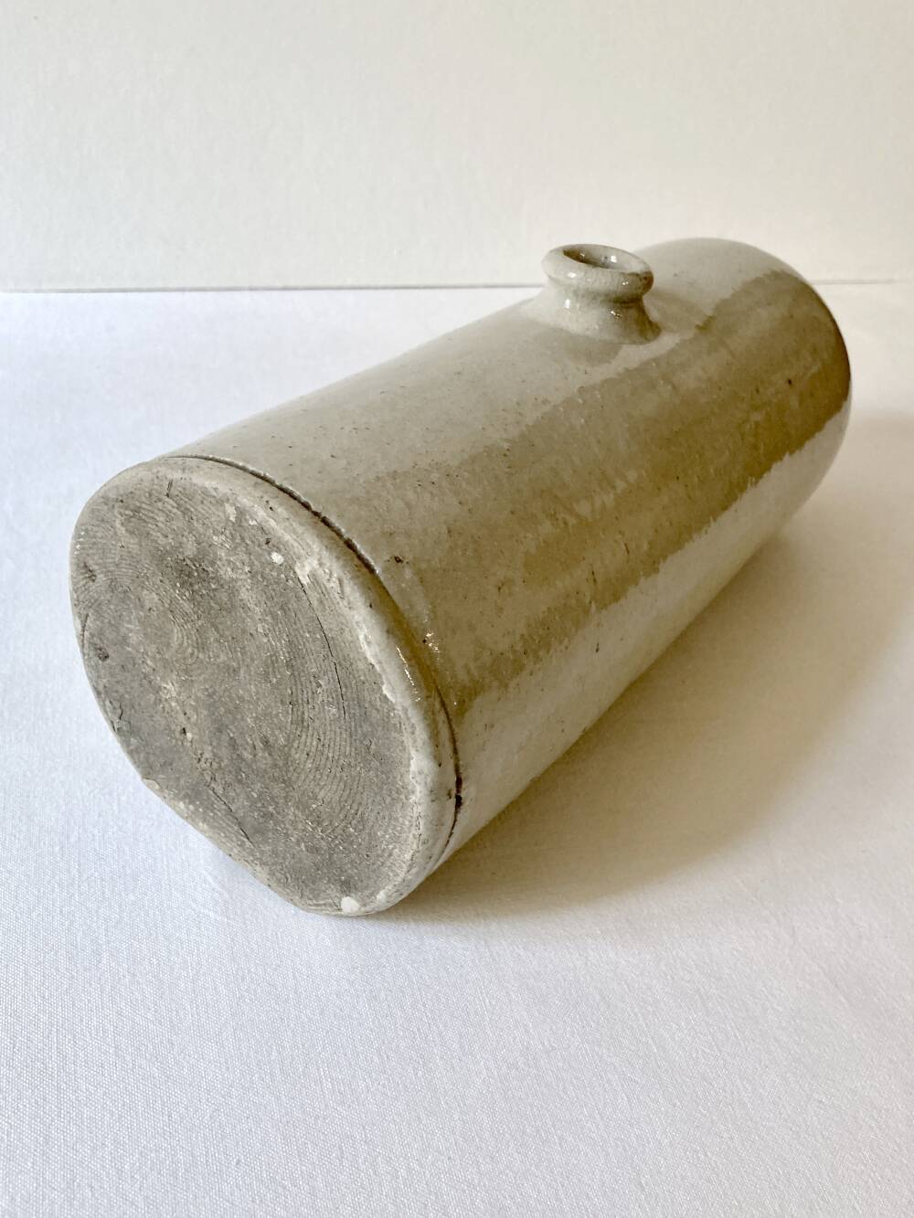 Old horizontal glazed stoneware hot water bottle, late 19th century.