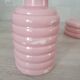 Set of pink and gold ceramic bathroom accessories