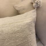 White cushion cover with pom poms