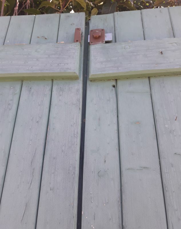 Pair of large wooden iron hanging shutters