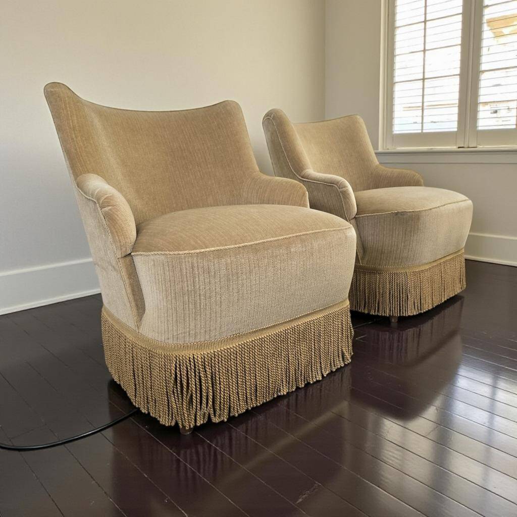 Set of 2 vintage 'gold' armchairs with fringes.