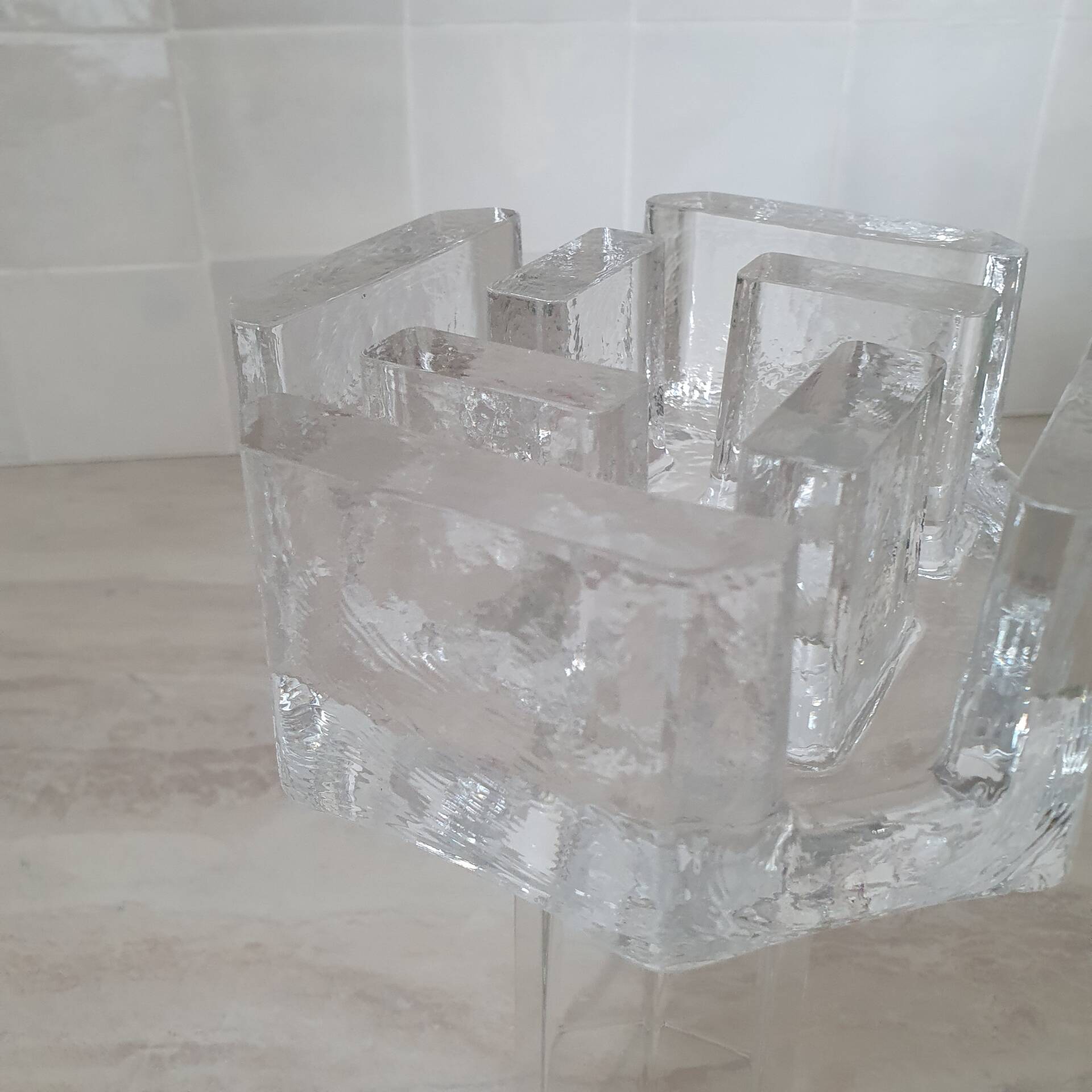 Candle holder or glass warmer with irregular ice effect.