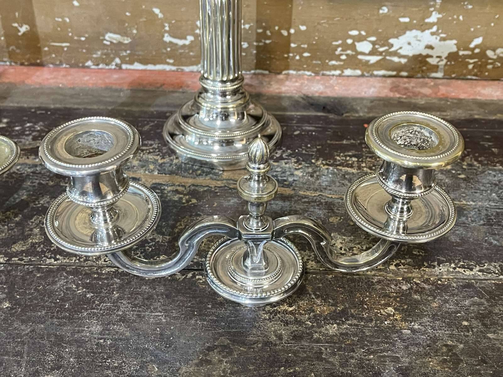Pair of 2-branched candlesticks in silver metal