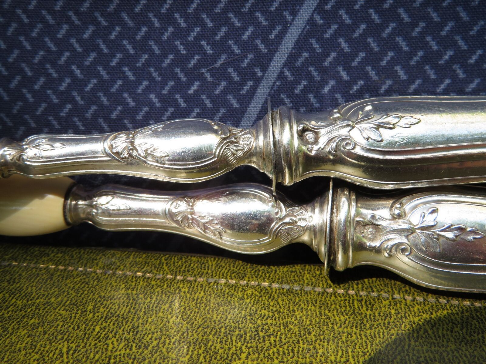 Silver salad servers stuffed in its case