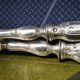 Silver salad servers stuffed in its case