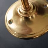 Brass and frosted glass wall lights