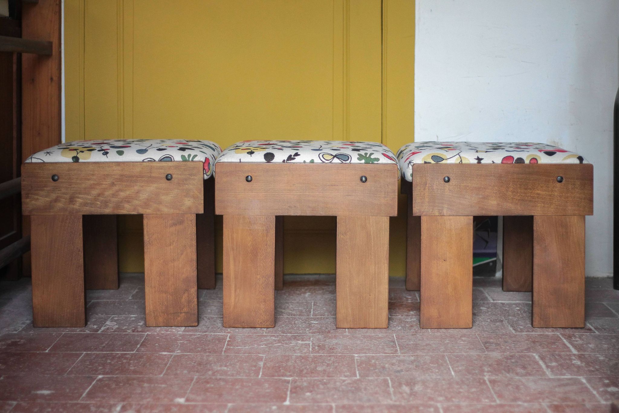 Set of 3 beech wood stools with fabric upholstery in the style of Miro.
