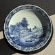 Vintage hollow circular plate in blue and white Boch pottery.