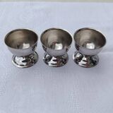 A set of 3 egg cups by Guy Degrenne.
