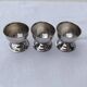 A set of 3 egg cups by Guy Degrenne.