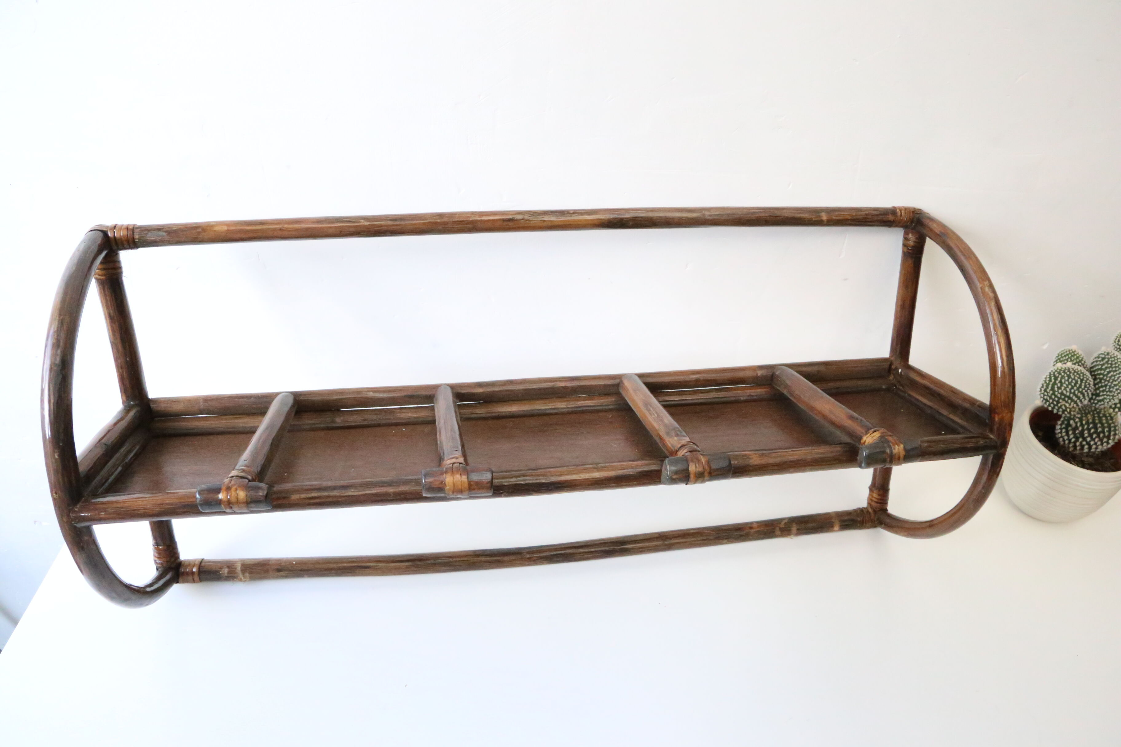 Rattan wall coat holder