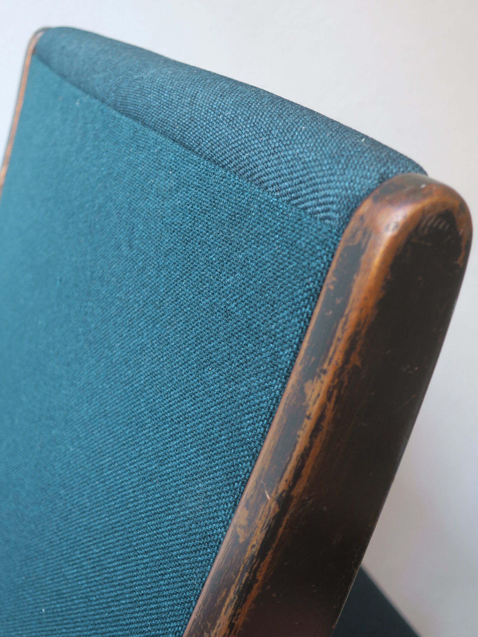 Jens Risom armless chair with ebonized frame and petrol blue-green covers