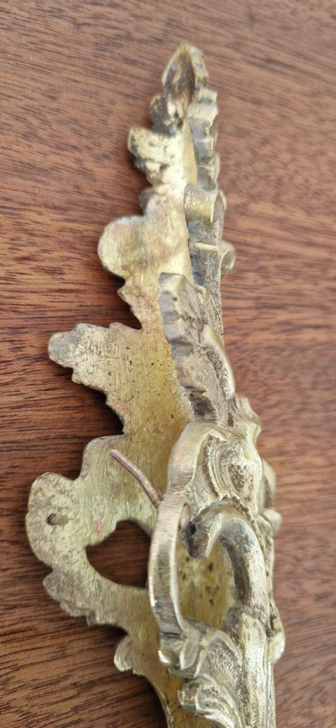 Antique bronze ornaments and pediment