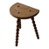Antique solid wood stool with turned legs.