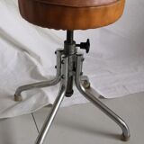 Vintage rotating stool seated in leather and chrome legs