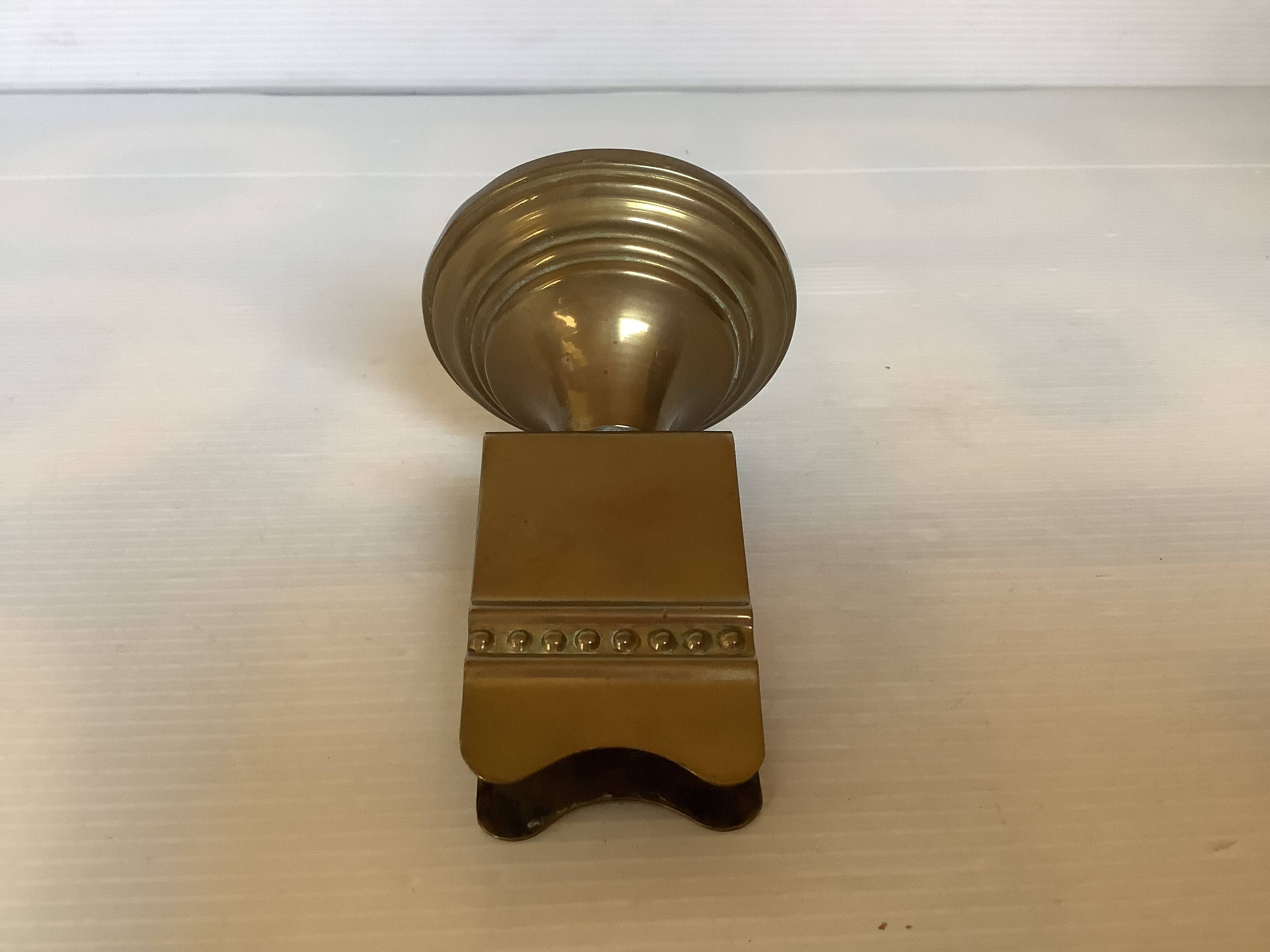 Antique brass match holder with tulip base.