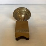Antique brass match holder with tulip base.