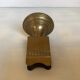 Antique brass match holder with tulip base.