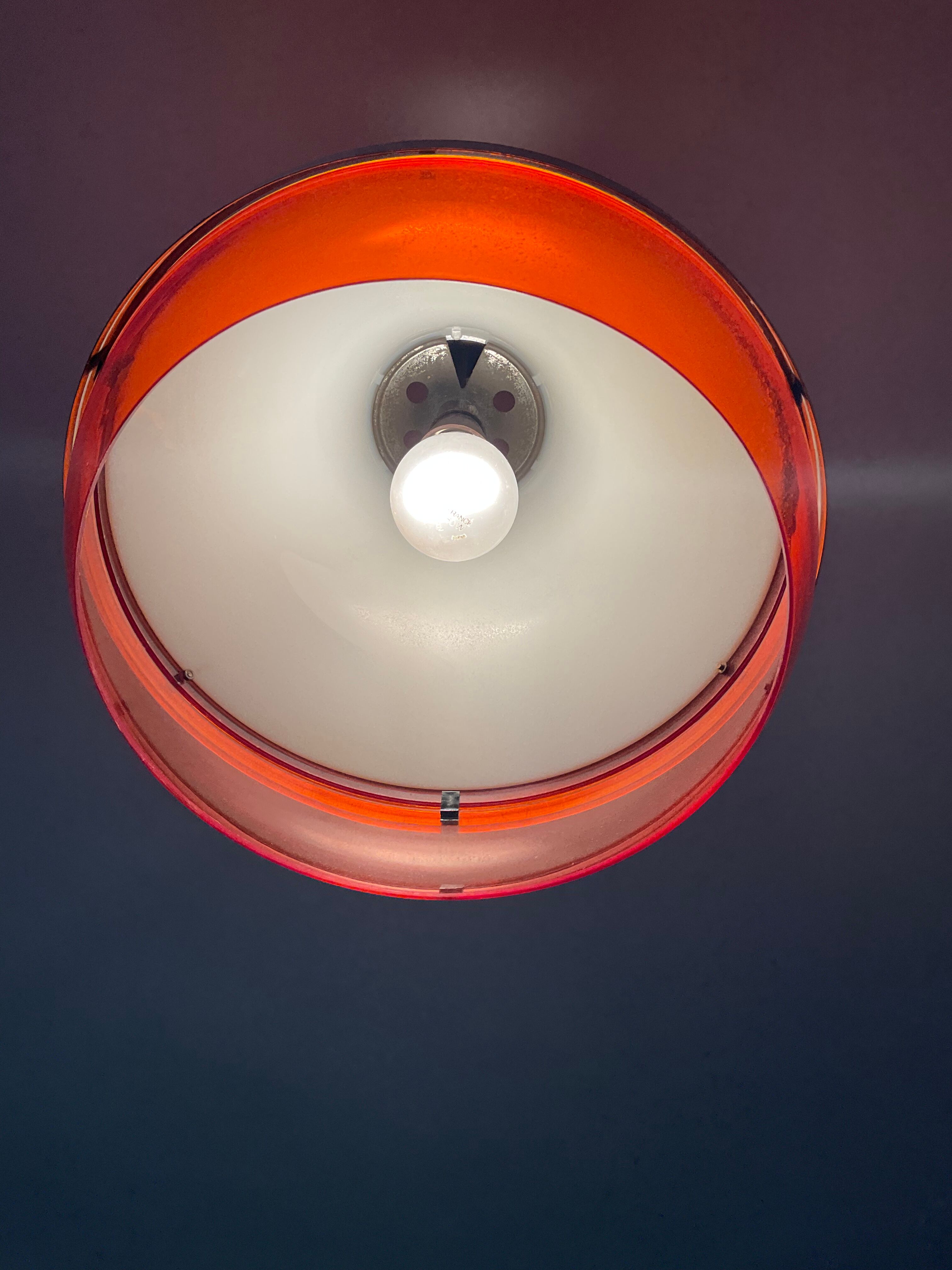 Space age pendant lamp in orange plexiglass and chromed metal