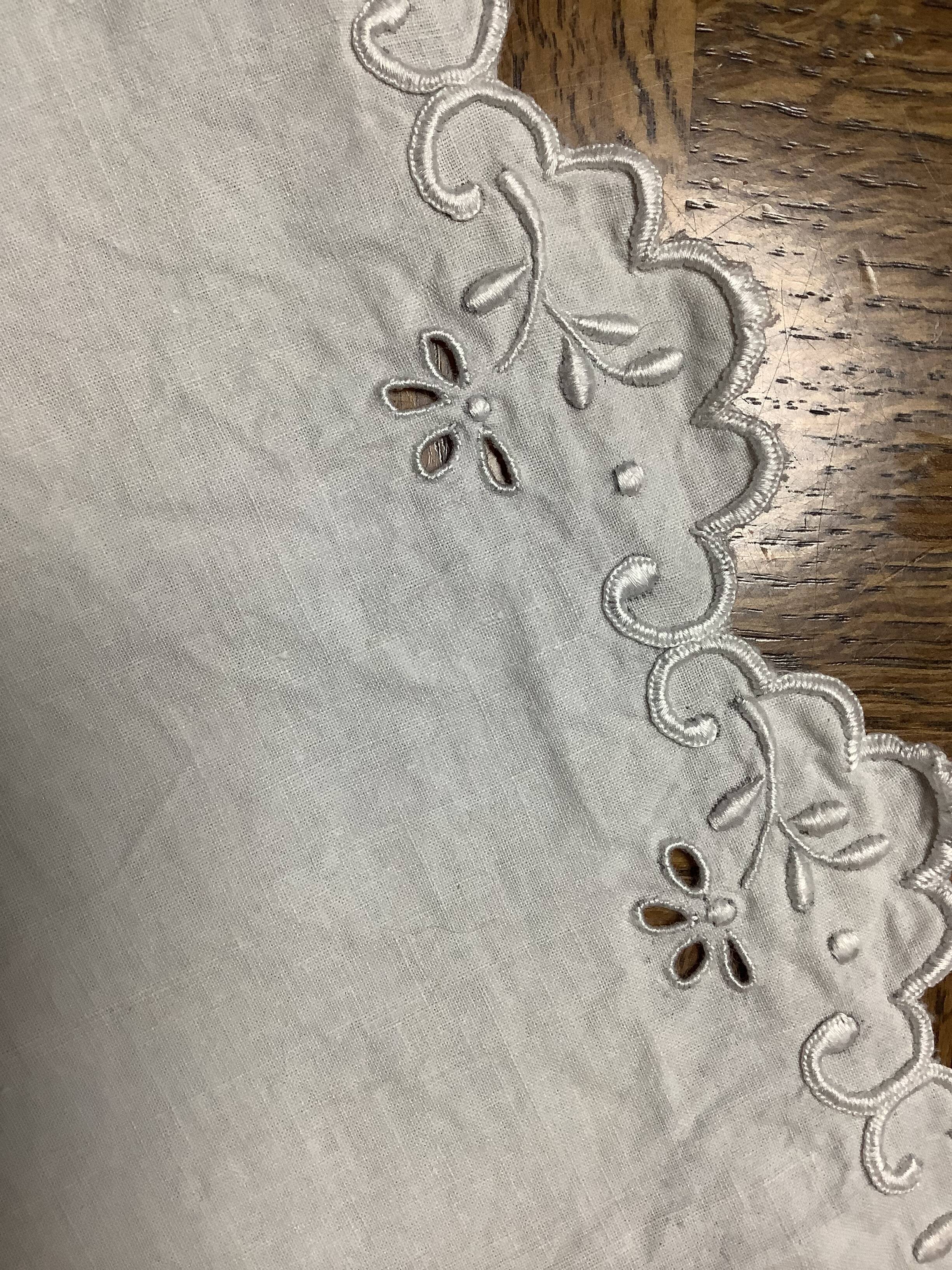 Embroidered table placemat with initials AW