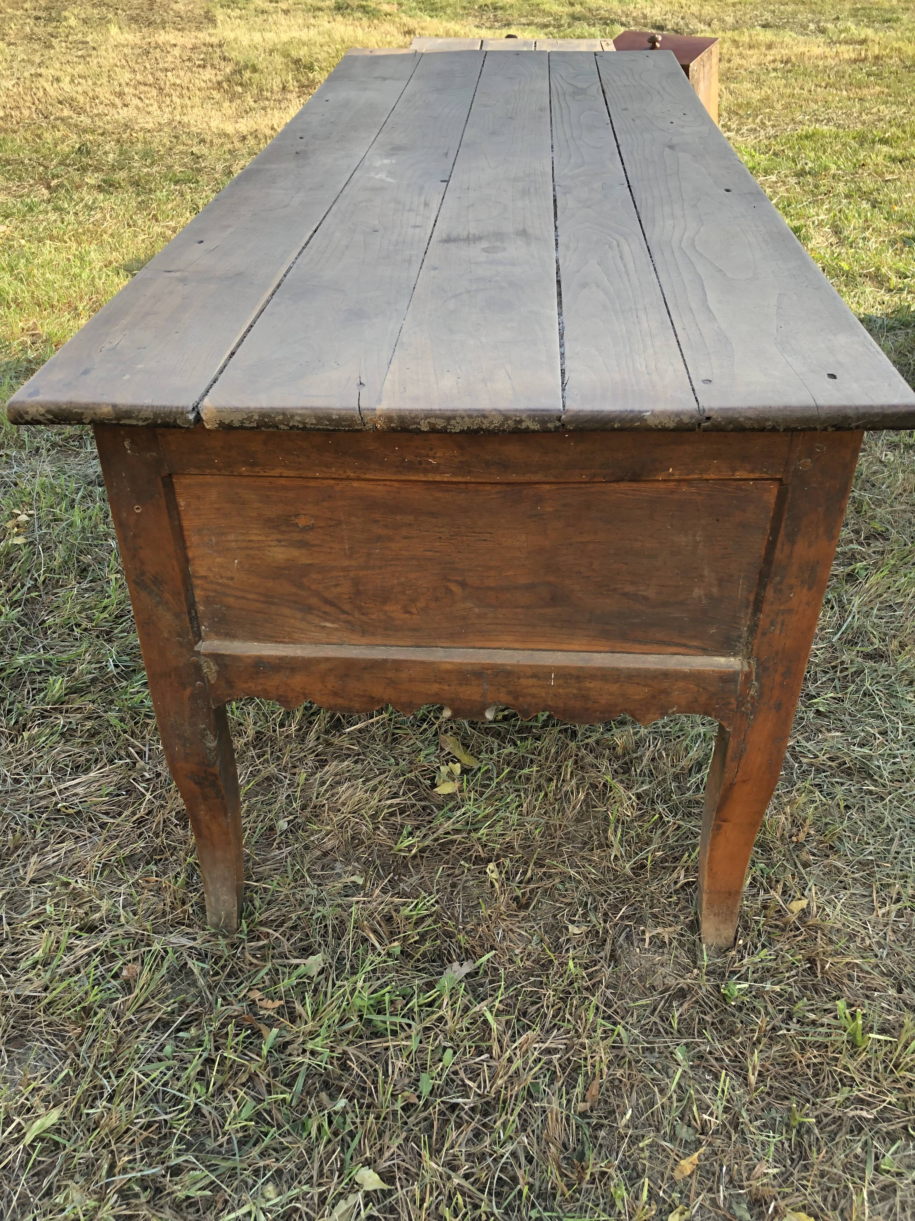 Antique Louis XV paneled table with 3 front drawers in solid cherry wood