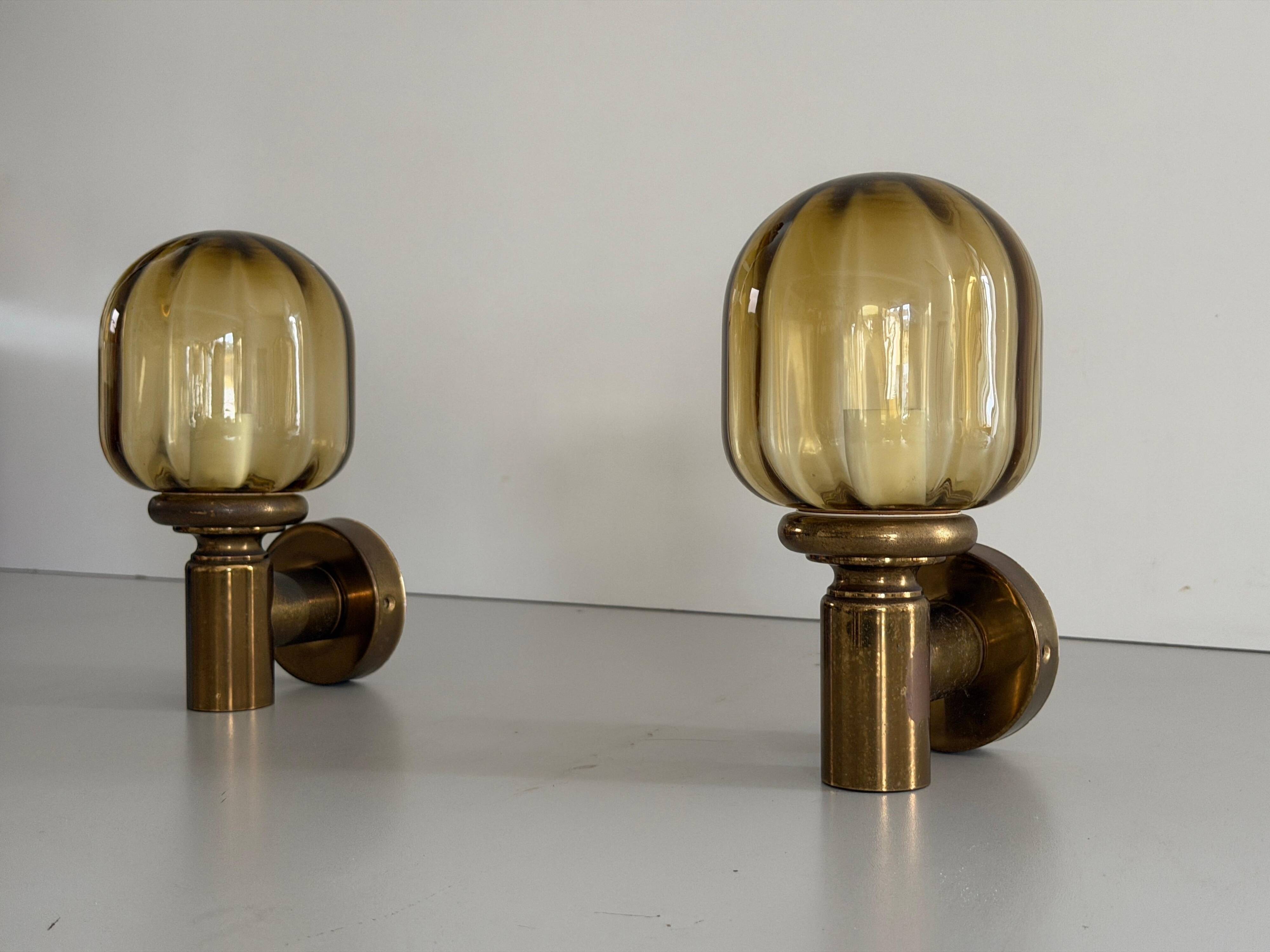 Pair of yellow glass and brass wall lights from the mid-century by N Leuchten, 1960s, Germany.