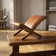 Old retro footstool, mid-century wooden leather stool, mid 20th century, European